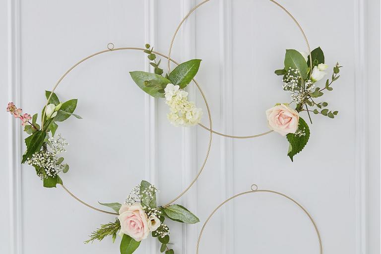 Golden coloured floral hoops for a wedding party.