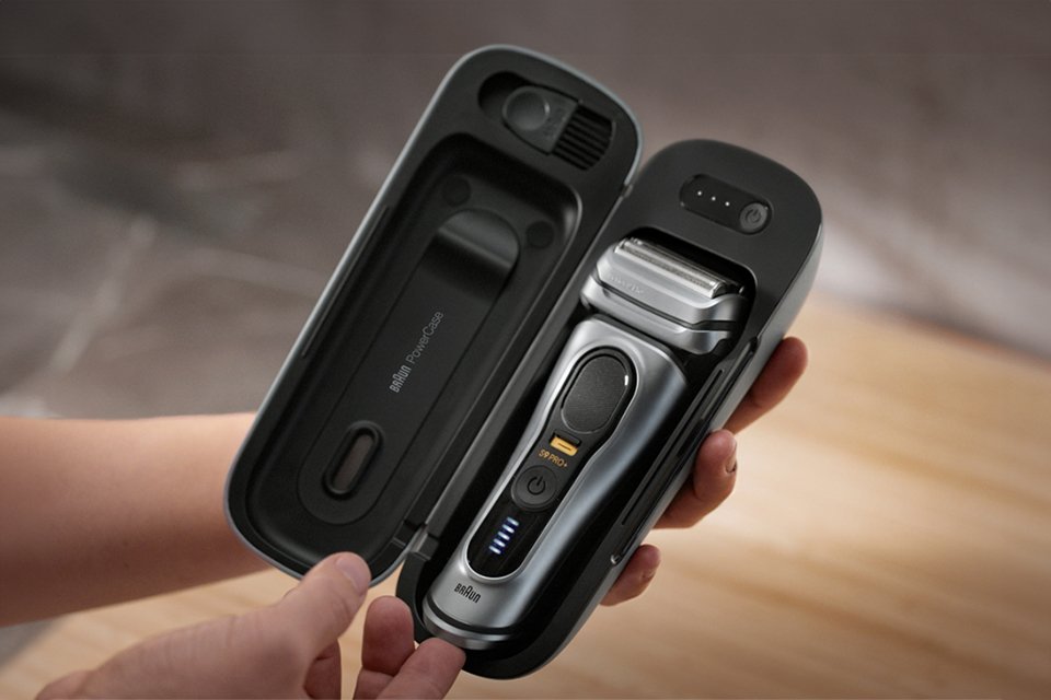 An open view of a Braun electric shaver kit.