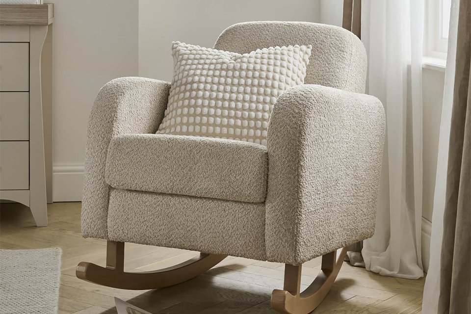 A Cuddleco Etta Nursing chair in a bedroom.