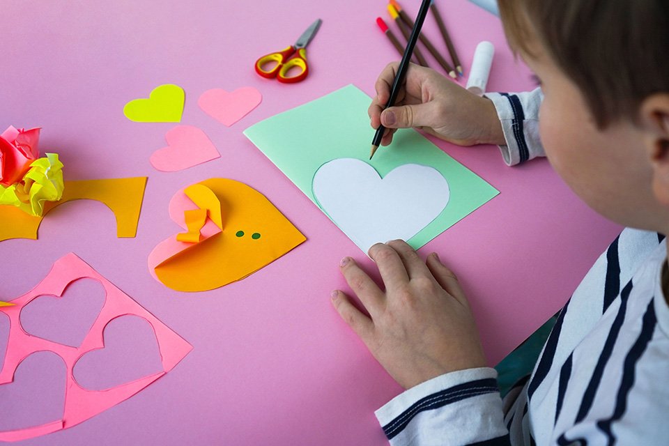 A collage of kids making cards for Christmas, Mother's day, Valentine's day and Father's day.