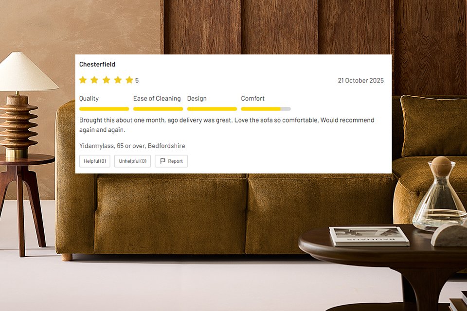 Close-up of a stylish brown velvet sofa with wooden side table and lamp, featuring a five-star customer review overlay praising quality and comfort, Habitat branding visible.