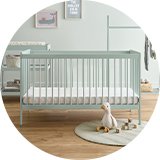 A nursery furniture set in a room.