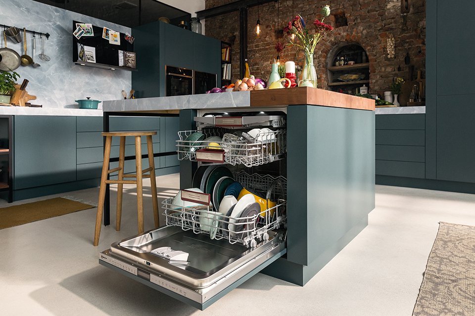 An opened view of a NEFF dishwasher in a teal coloured kitchen. 