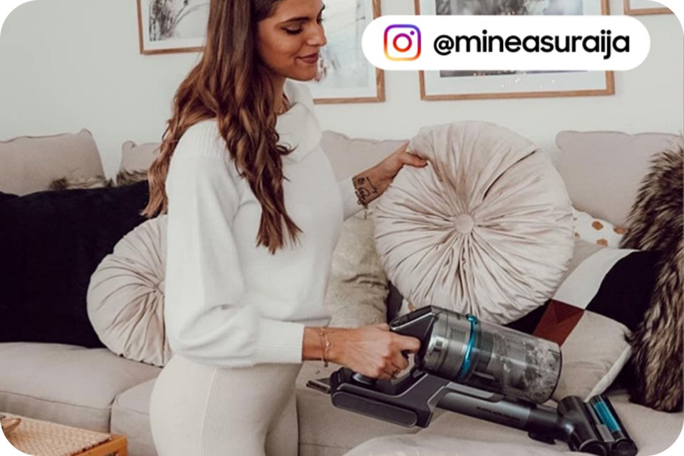 A shot of woman vacuuming a sofa with a Samsung vacuum cleaner with Instagram ID @mineasuraija written on the picture.