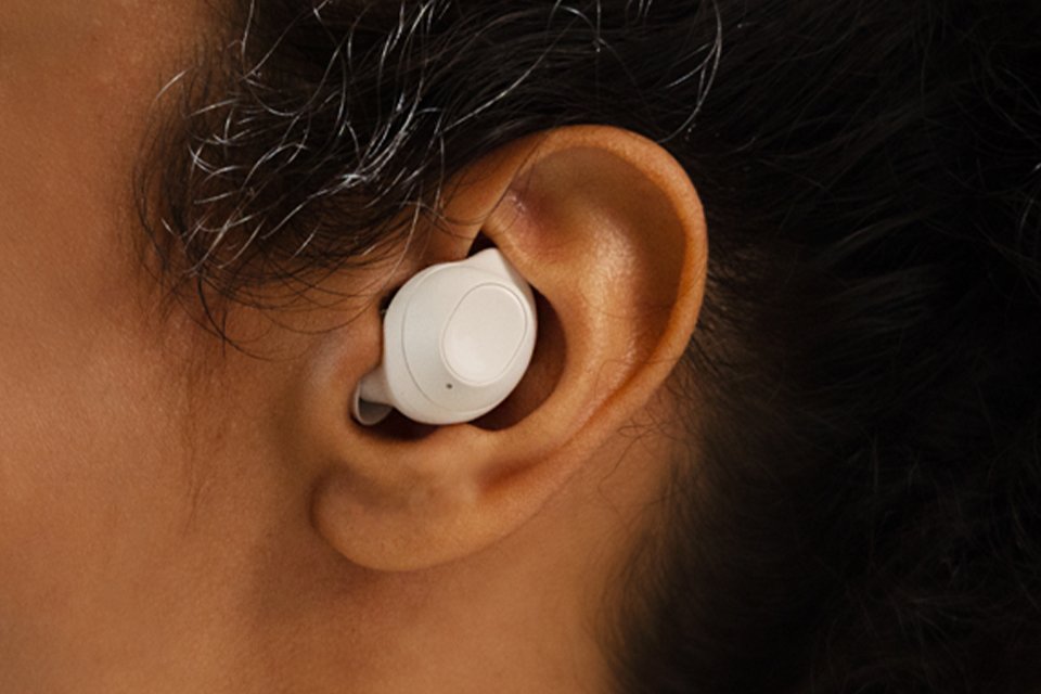 Samsung Galaxy Buds FE earbud placed in an ear.