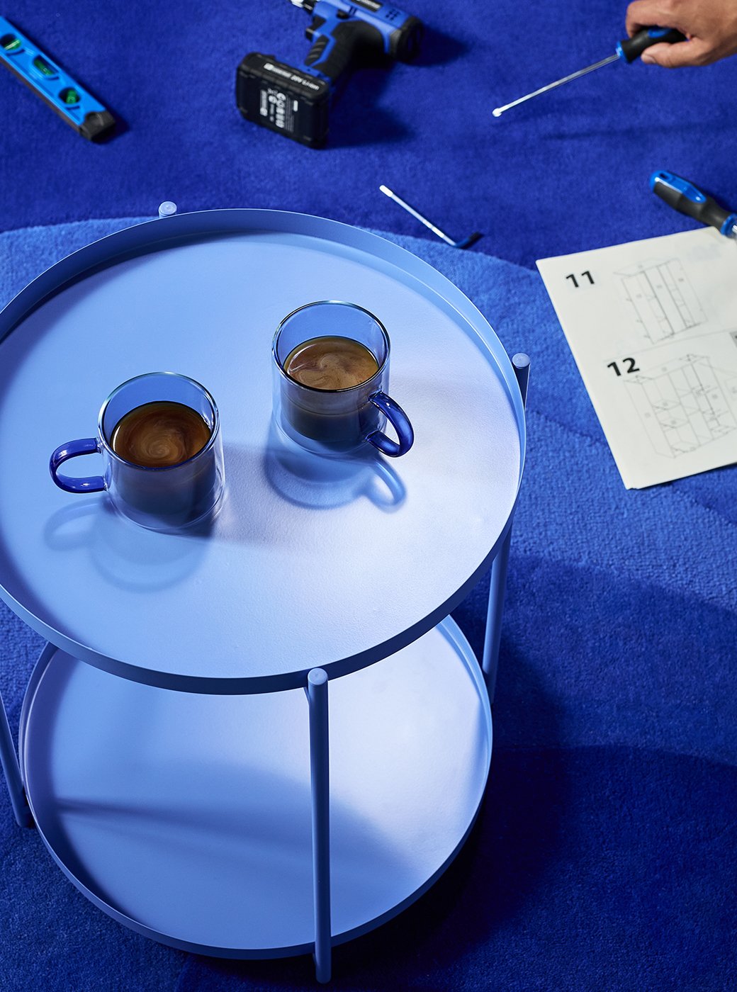 Blue mug on blue table for airtasker man's break with instructions next to it .