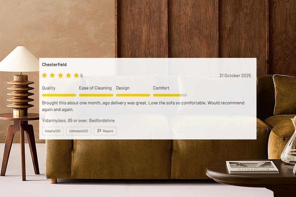 Close-up of a stylish brown velvet sofa with wooden side table and lamp, featuring a five-star customer review overlay praising quality and comfort, Habitat branding visible.