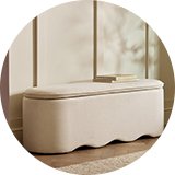 Cream rectangle puffe with scallopped edging.