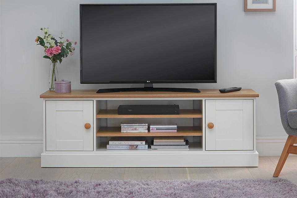 TV on wooden TV stand.