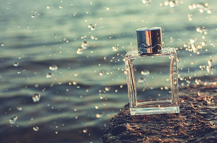 A fragrance bottle by the water.