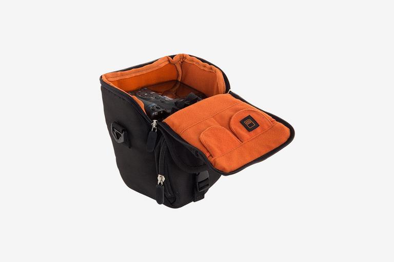 Black camera bag with orange interior.