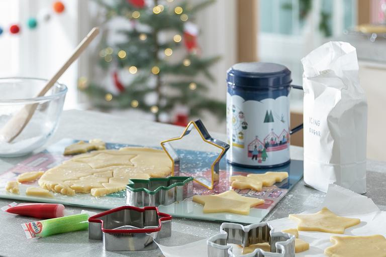 Image of festive cookie cutters and other baking equipment.