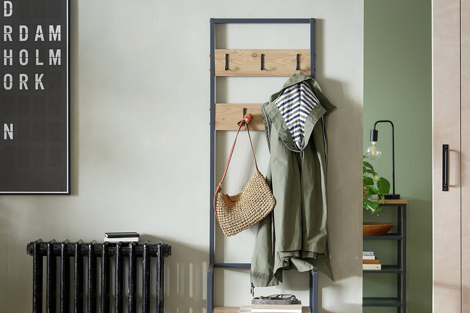 Habitat Loft Living Hallway Tree in oak finish placed in a hallway.
