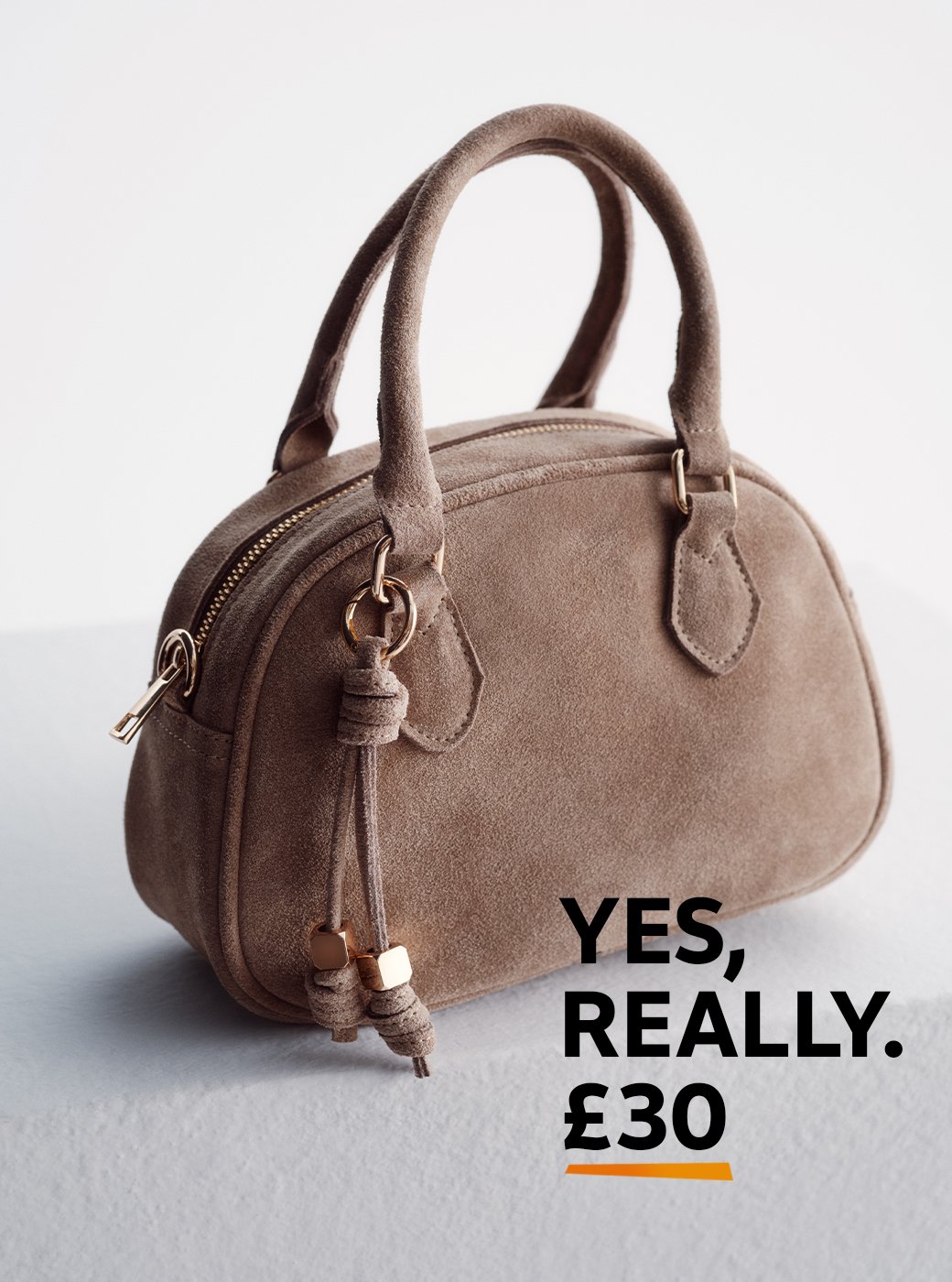 An image of a neutral sudemini bowler cross body bag.