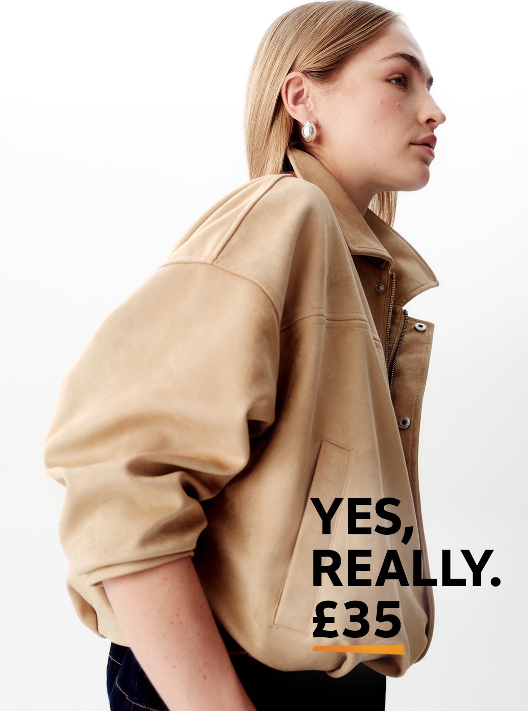 A woman wearing a neutral bubble hem jacket.