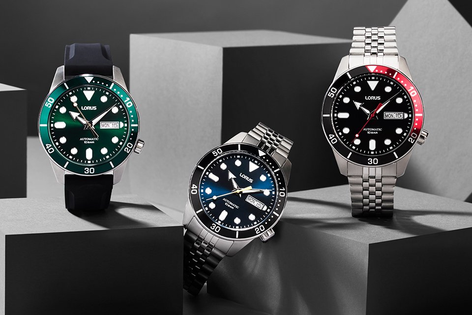 Three Lorus automatic watches with different coloured dials.