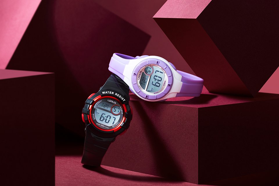 Two Lorus kids watches, one black and red coloured and other white and purple coloured.