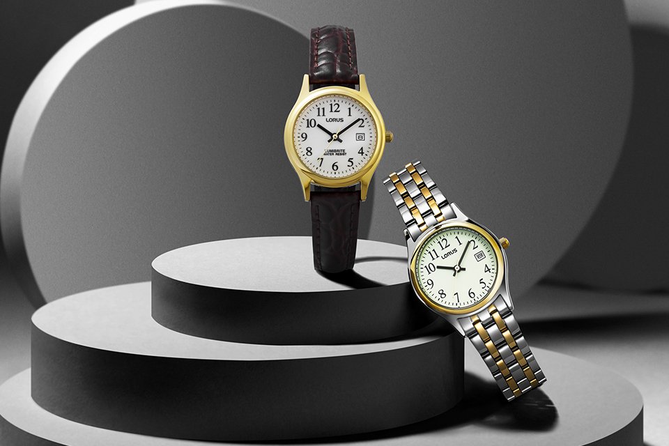 Two Lorus ladies watches with leather and metallic straps.