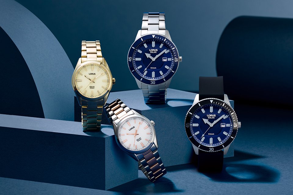 Four Lorus solar watches with navy blue, off-white and white coloured dials.