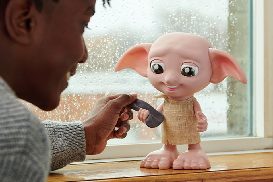 A child playing with Wizarding World Harry Potter Interactive Dobby.
