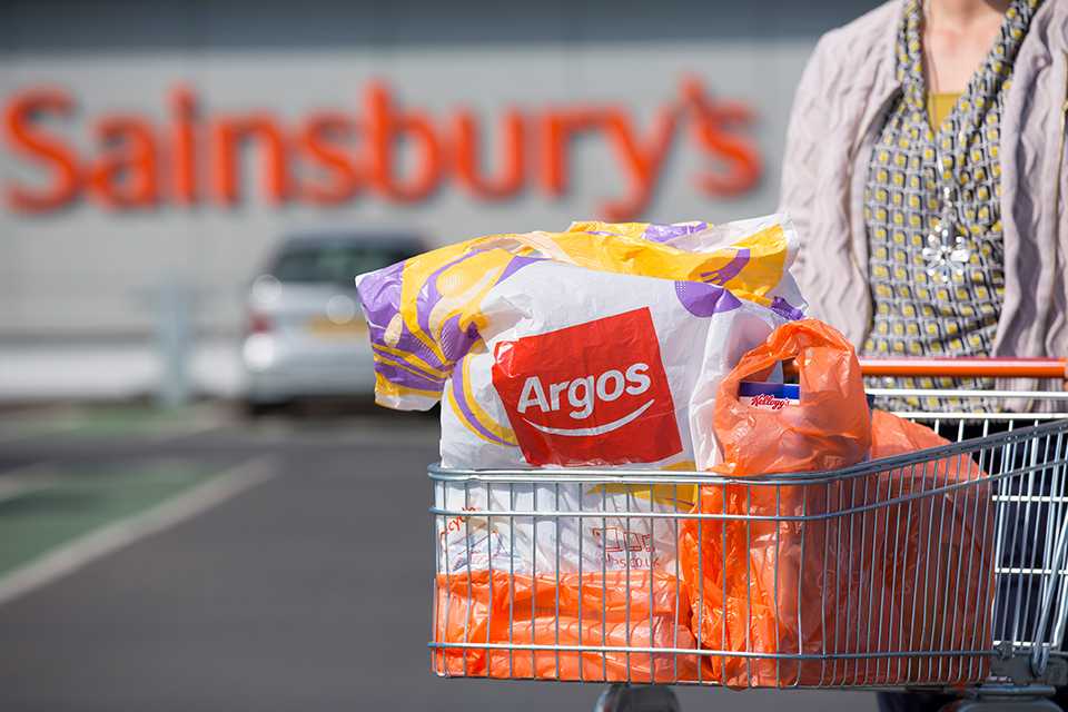 A trolley full of Sainsburys and Argos bags.