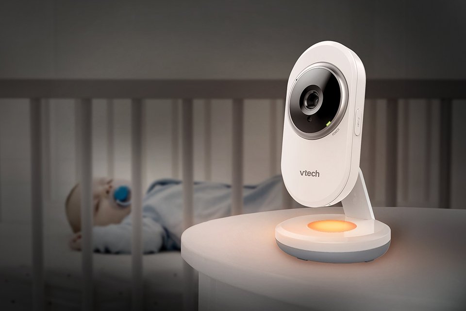 Vtech VM3254 -2 Video Baby Monitor placed next to a sleeping baby in a nursery.
