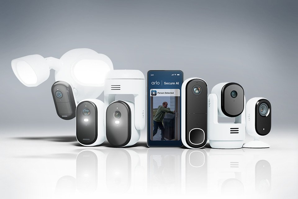 An assortment of white Arlo home security products against a grey background.