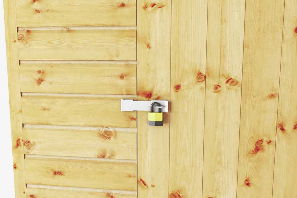 A padlock on a shed.