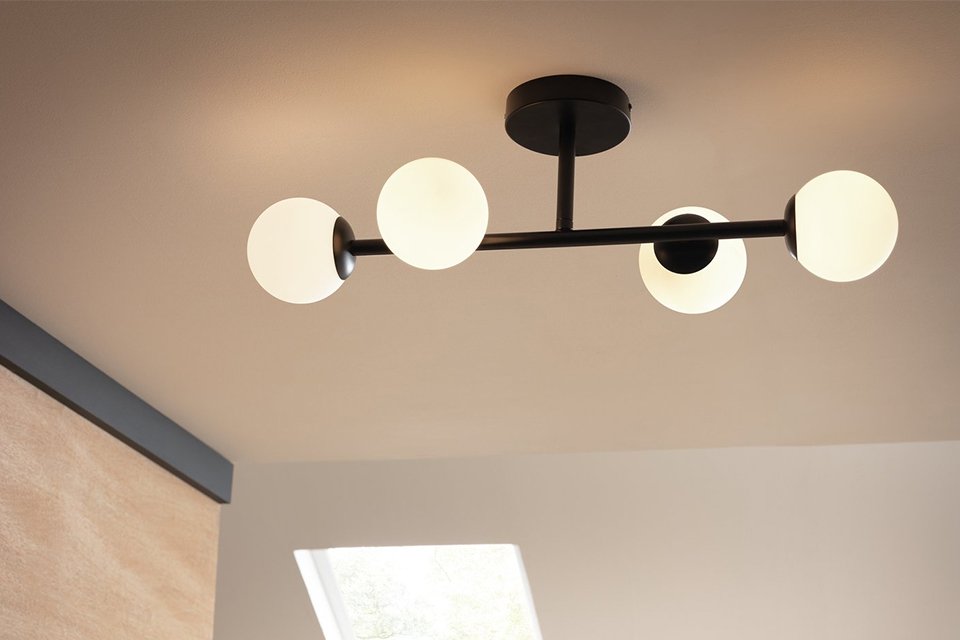 Ceiling light hanging in bathroom.