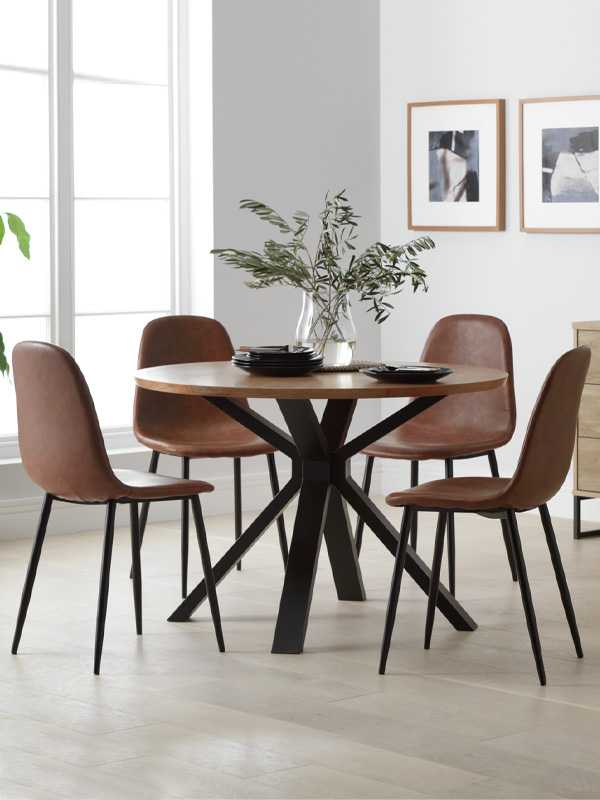 Dining room with round table and 4 chairs.