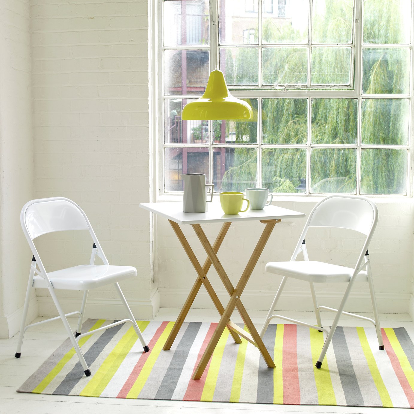 white folding table and chairs