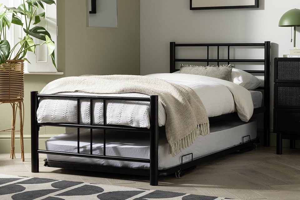 An Argos Home Atlas metal guest bed with two mattresses.