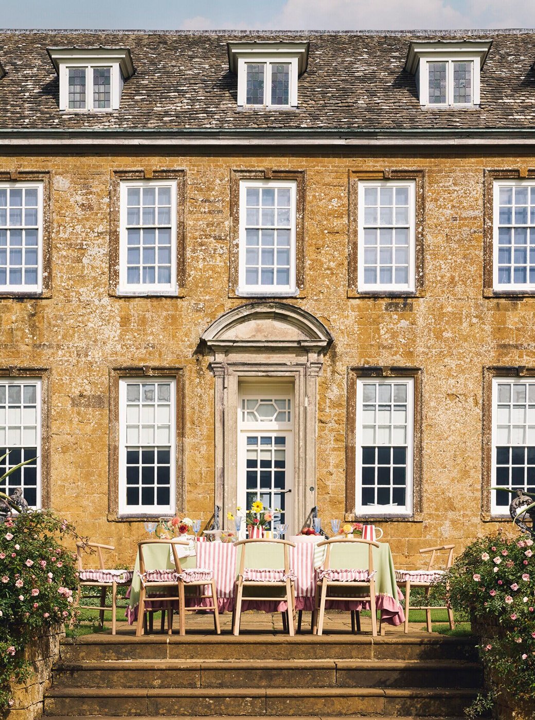 Habitat x National Trust collaboration table and chairs outside national trust house.