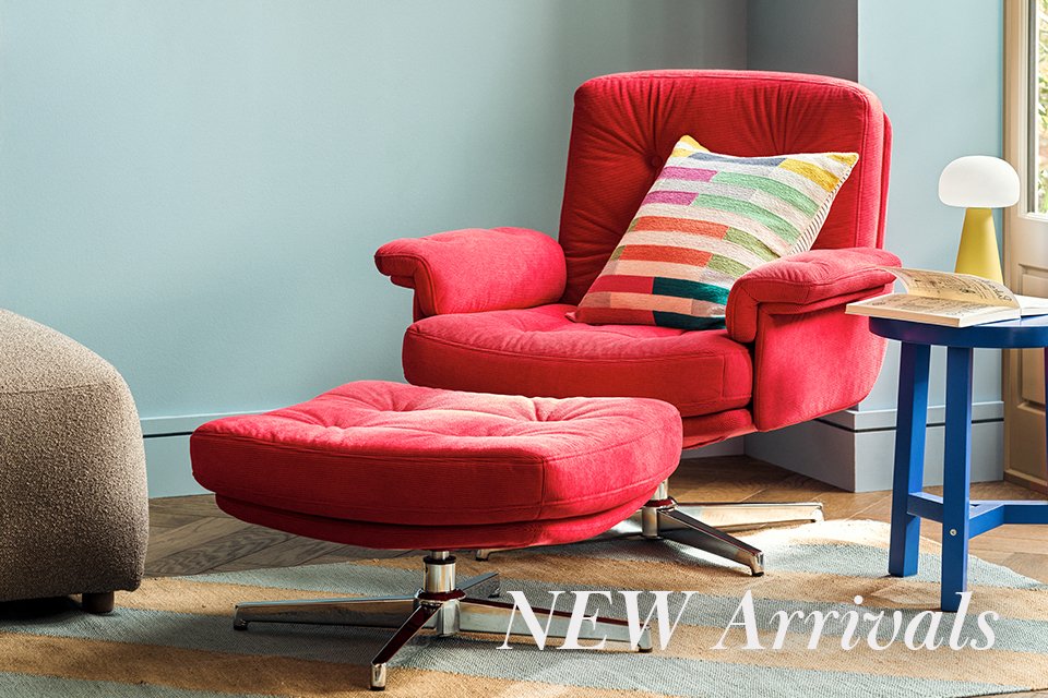 Dining room table wooden with matching benches and two boucle chairs either end.