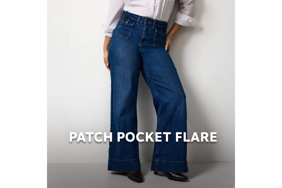 Model wearing high‑rise flared jeans with patch pockets in a relaxed fit. 