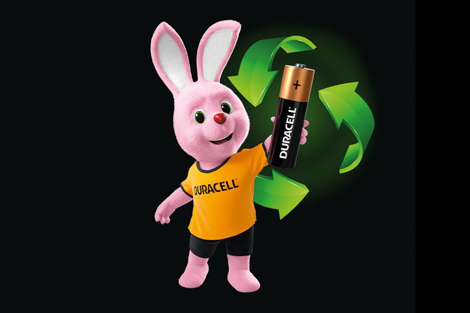 Bunny holding recyclable Duracell battery.