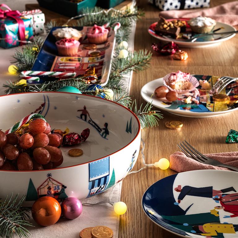 A festive table laid out with bright Christmas decorations.