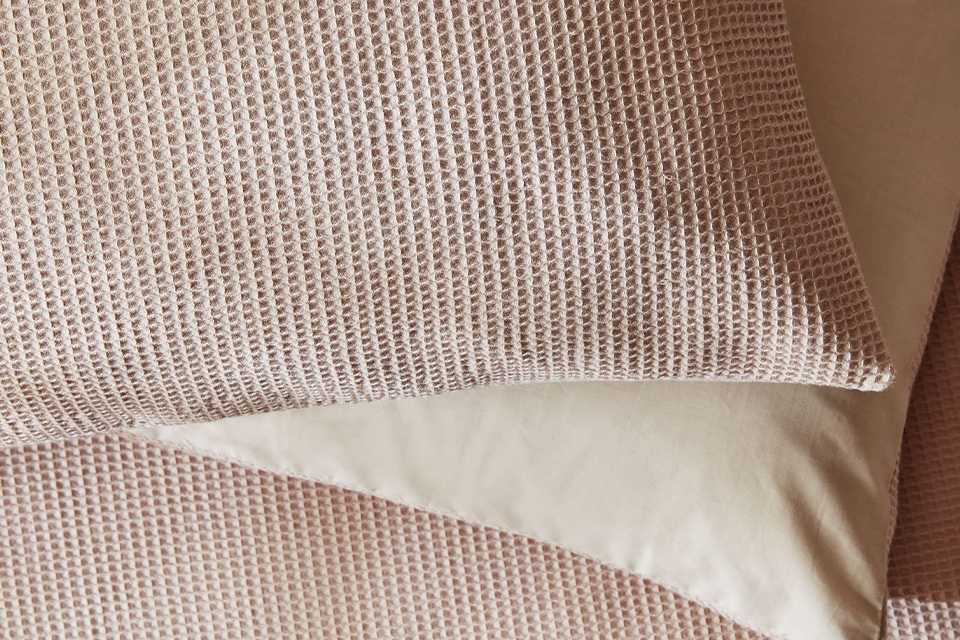 Pink waffle bedding.
