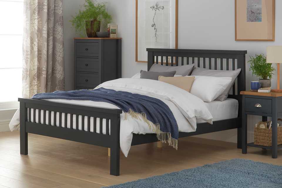 Black wooden double bed frame.