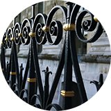 A fence painted with black gloss paint.