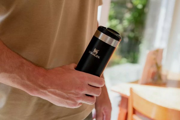 A man holding a cup.