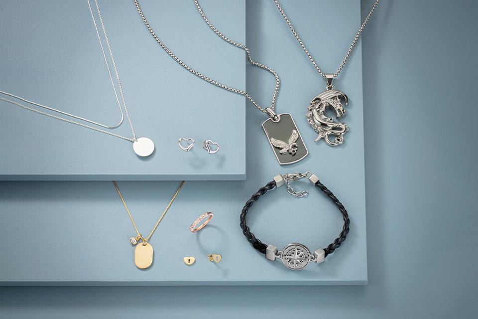 A collection of necklaces, rings, bracelets and dog tags.