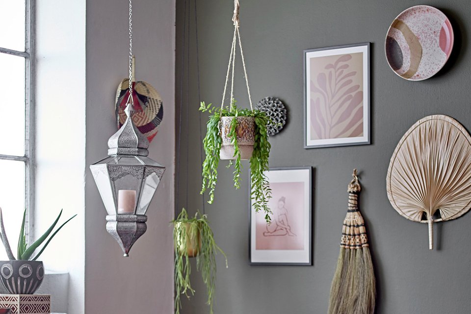 Bloomingville Palm Leaf Wall Décor in natural finish hung on a grey wall.