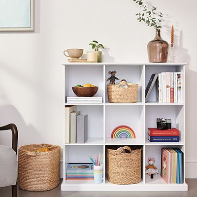 A kids' room with a white cube storage unit.