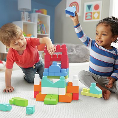Two children playing with Mega Bloks 60 Piece First Builders Big Building Bag - Pastel.
