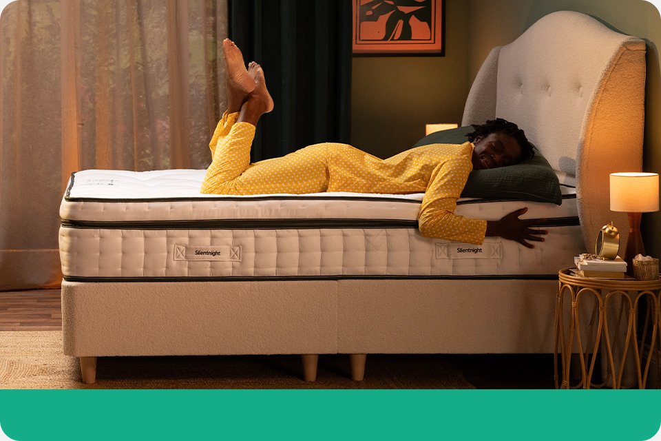 A person sleeping on a Silentnight Eco comfort mattress.