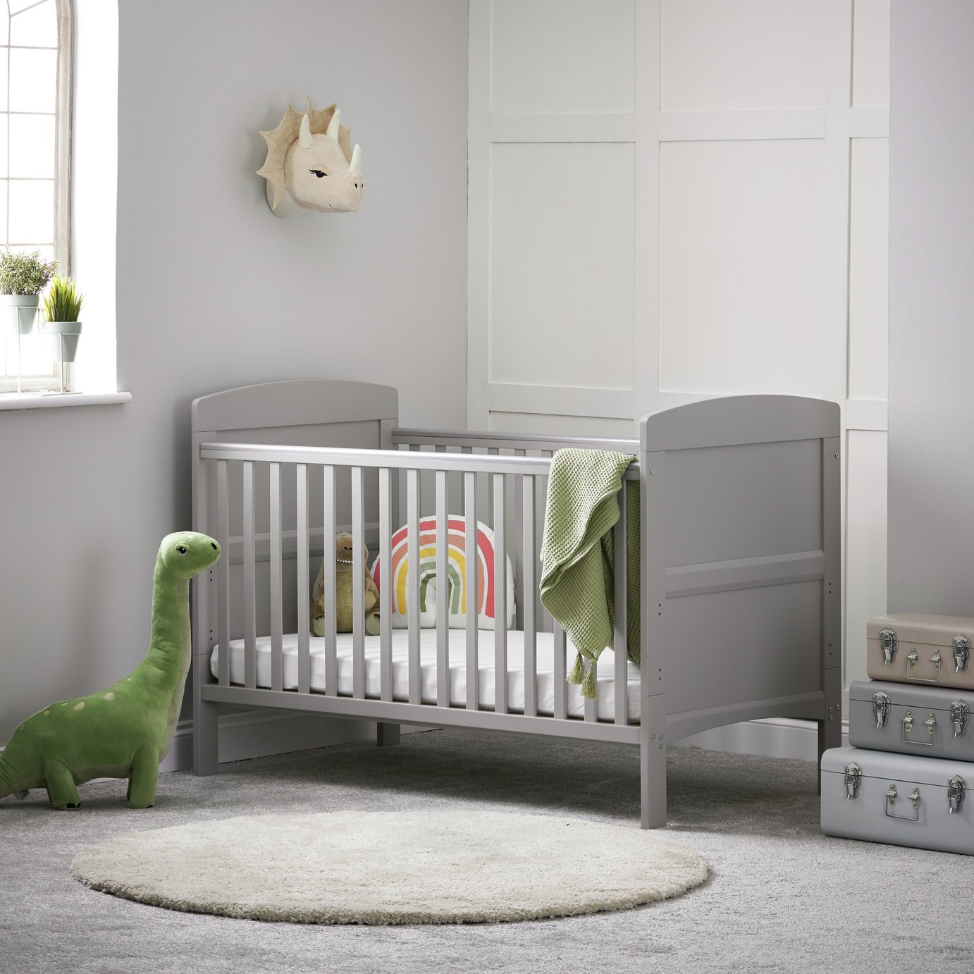 grey cot bed with mattress