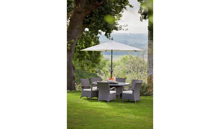 Rattan garden table and store chairs with parasol