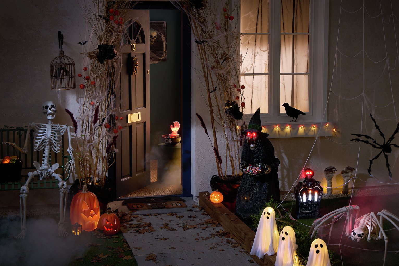 set up of the outside of a house decorated with Halloween decorations