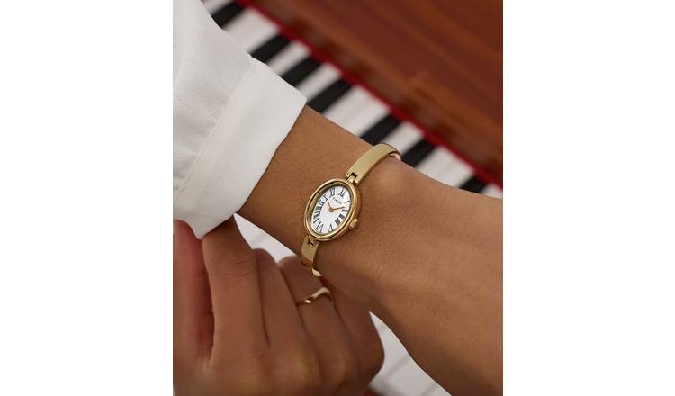 Goudkleurige bangle met hartje | Armbanden | field | field